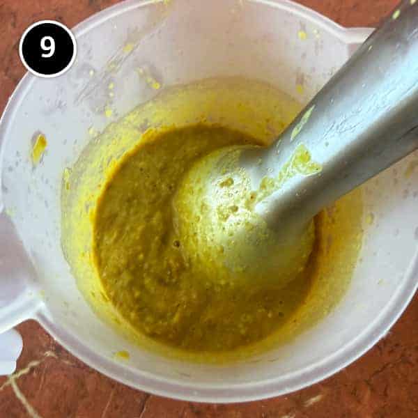 Adasi (Persian Lentil Soup) | cookeatworld.com A portion of adasi soup being blended until smooth