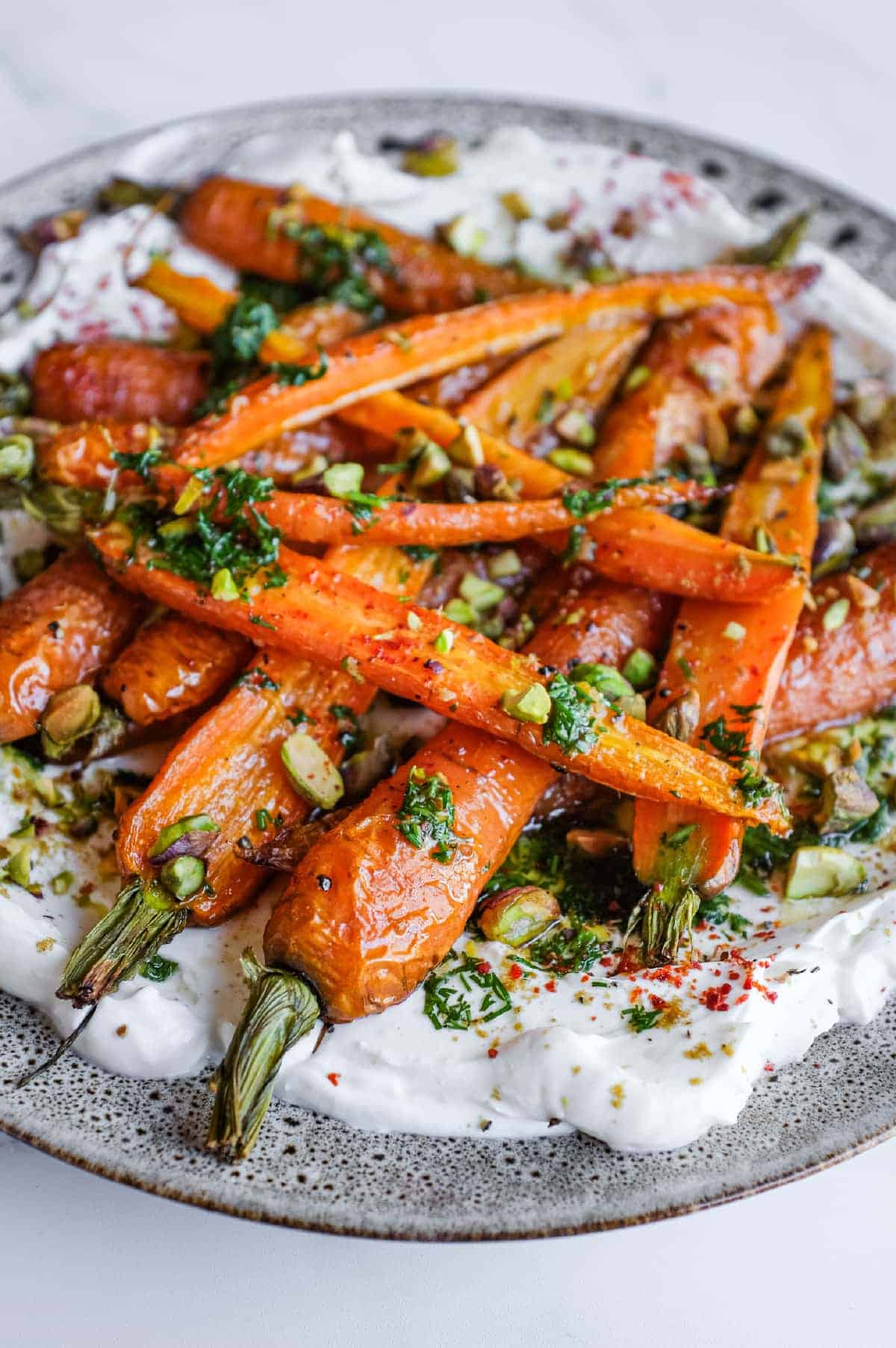 Sweet roasted carrots on a bed of tangy labneh with fresh dill and lemon dressing.