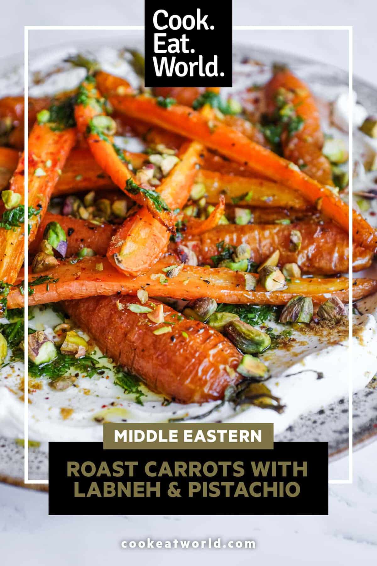 A vibrant platter of roasted carrots with lemon, labneh and toasted pistachios ready to serve.