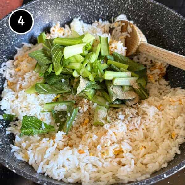 Vietnamese Crab Fried Rice | cookeatworld.com Vietnamese fried rice and Asian greens cooking over high heat