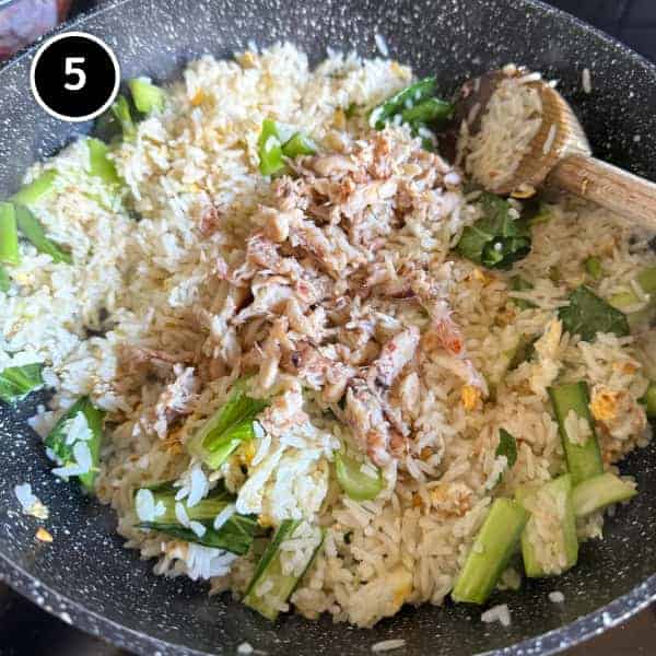 Vietnamese Crab Fried Rice | cookeatworld.com Crabmeat being folded through hot Vietnamese fried rice