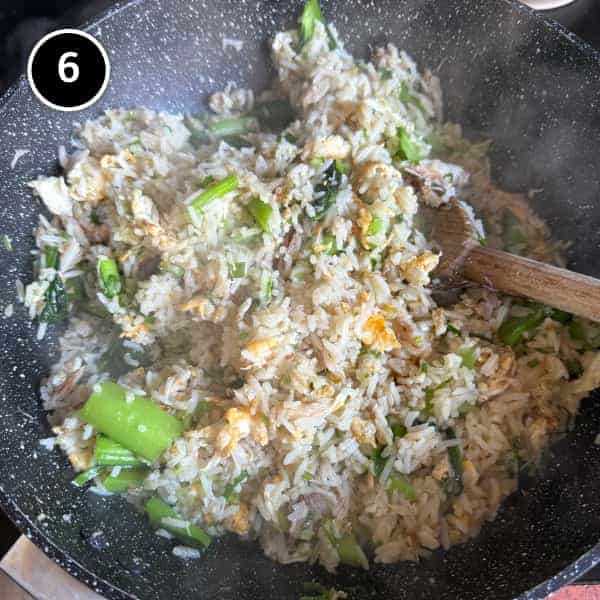 Vietnamese Crab Fried Rice | cookeatworld.com Crabmeat being folded through hot Vietnamese fried rice
