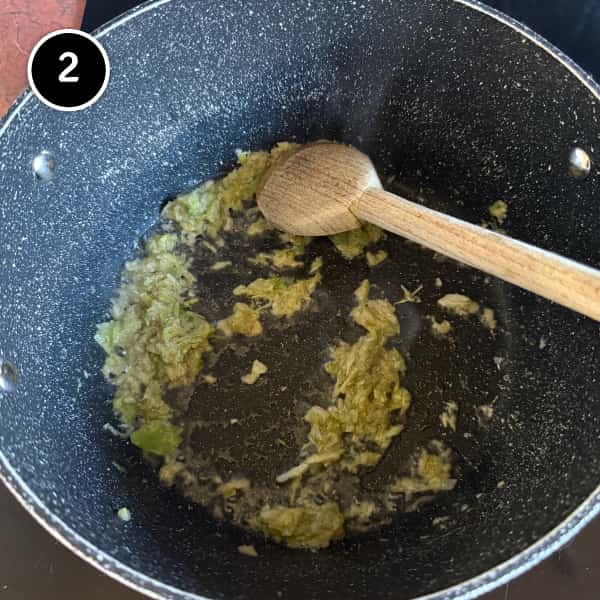 Garlic, coriander and spring onion paste frying in oil until fragrant