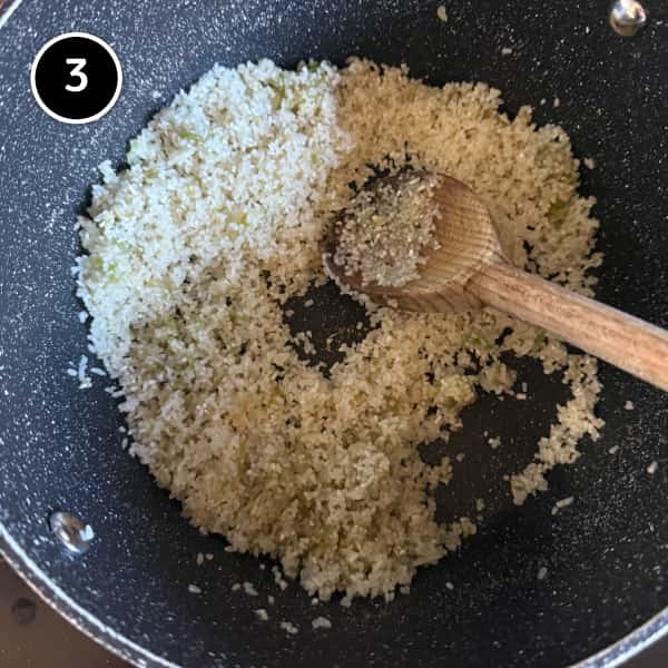 Broken rice stirred through the fried garlic, coriander and spring onion mixture