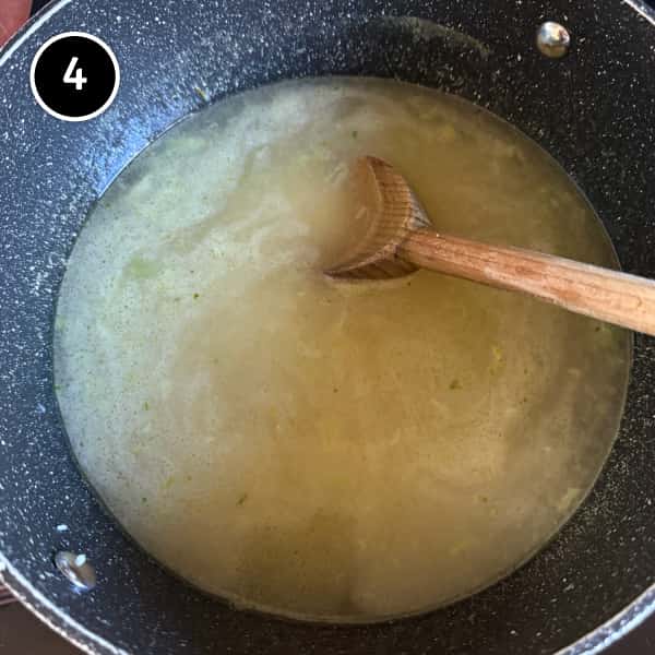 Thai rice soup simmering with broken rice, fish sauce, white pepper and chicken stock