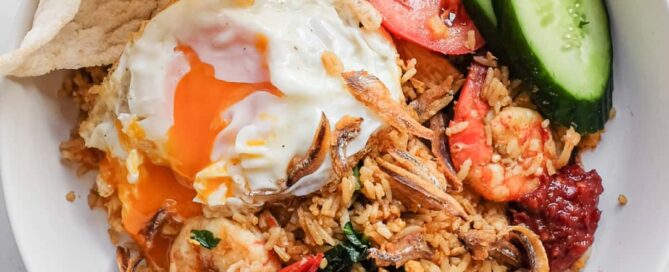 Close-up of Malaysian fried rice topped with crispy anchovies
