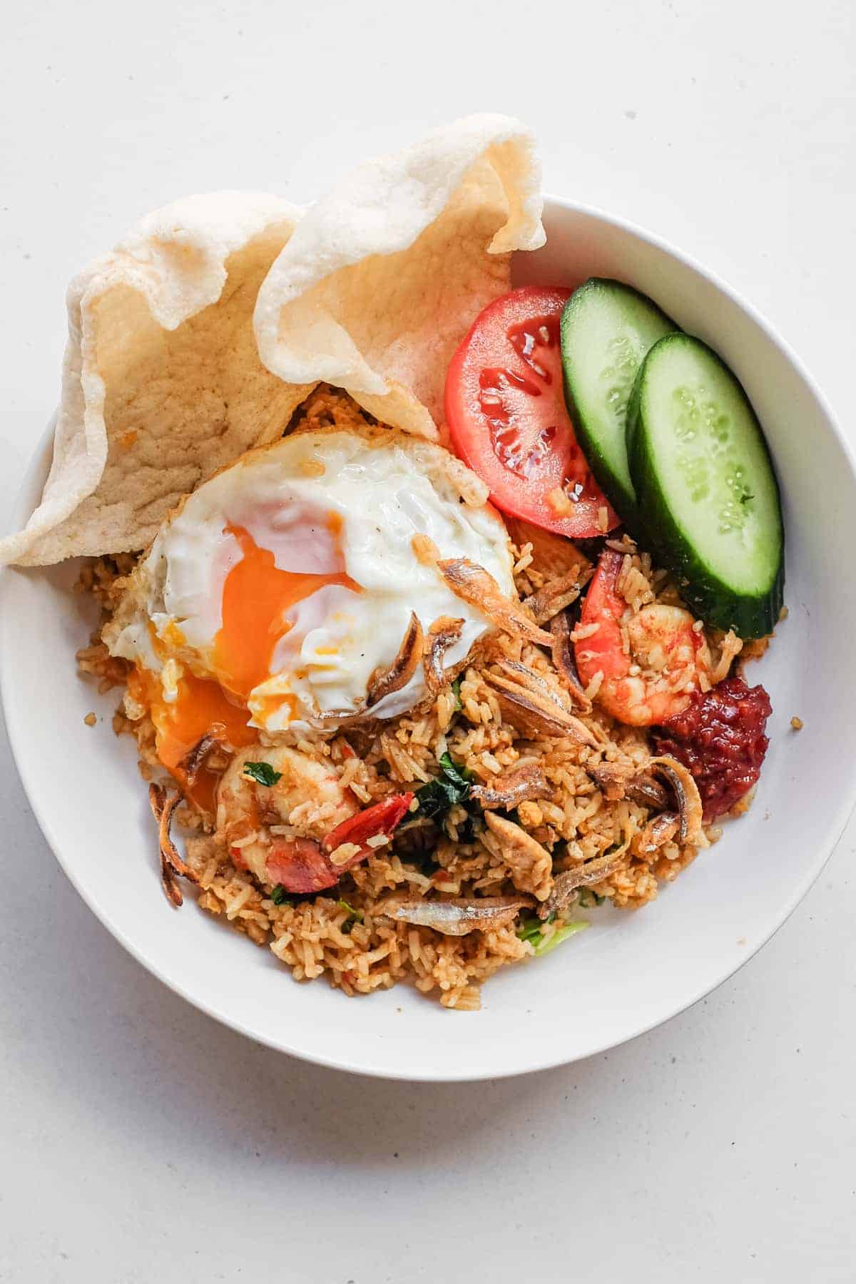 Close-up of Malaysian fried rice topped with crispy anchovies
