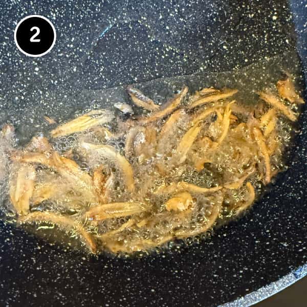 Nasi Goreng Kampung (Malaysian Fried Rice) | cookeatworld.com Ikan bilis frying in hot oil until golden and crisp
