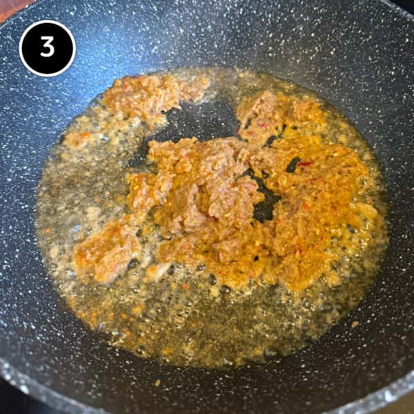 Nasi Goreng Kampung (Malaysian Fried Rice) | cookeatworld.com Nasi goreng spice paste frying in a wok