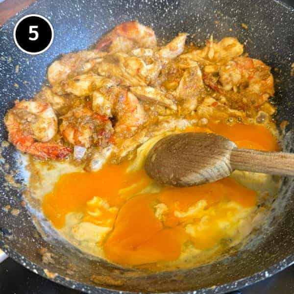Nasi Goreng Kampung (Malaysian Fried Rice) | cookeatworld.com Eggs being scrambled into Malaysian nasi goreng mixture