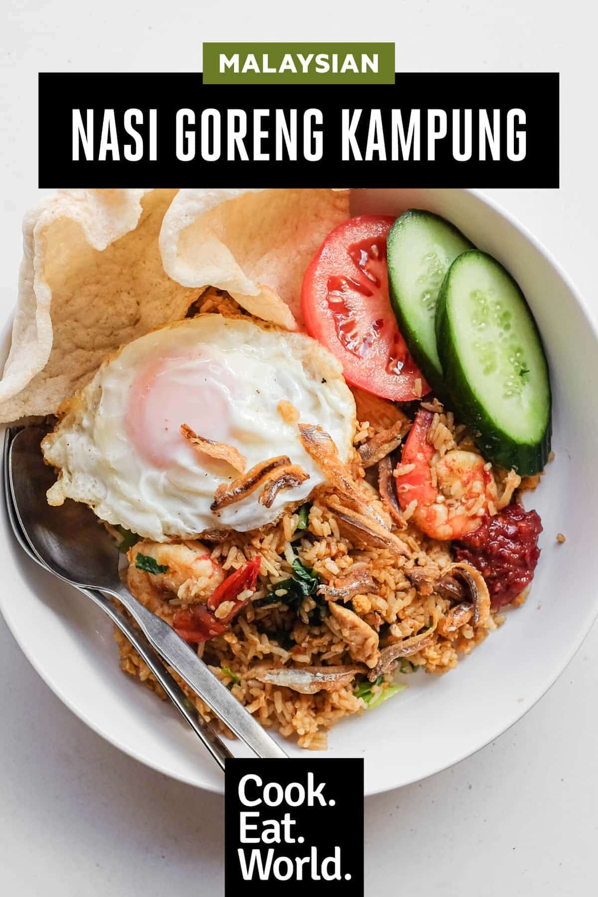 Nasi goreng kampung served with cucumber, tomato and prawn crackers