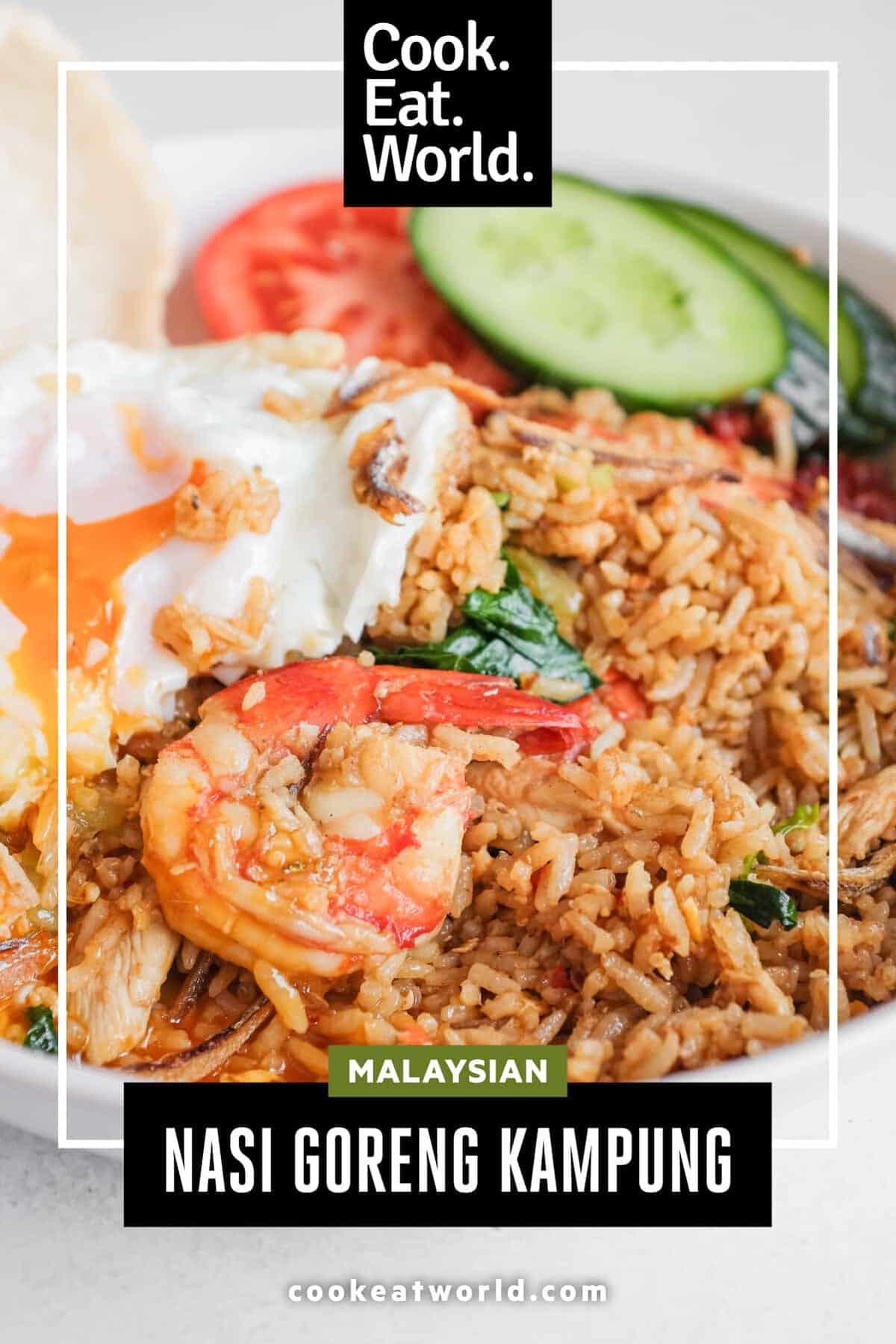 Bowl of spicy Malaysian fried rice with chicken, prawns and fried egg