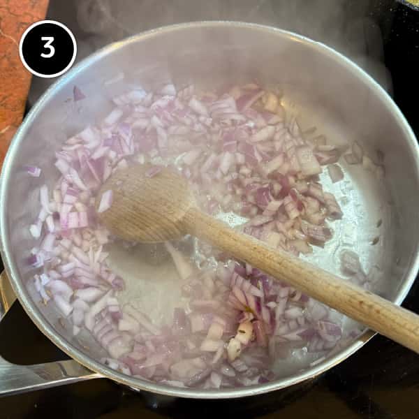 Paneer Bhurji (Indian Scrambled Paneer) | cookeatworld.com Onions frying in a saute pan with cumin seeds