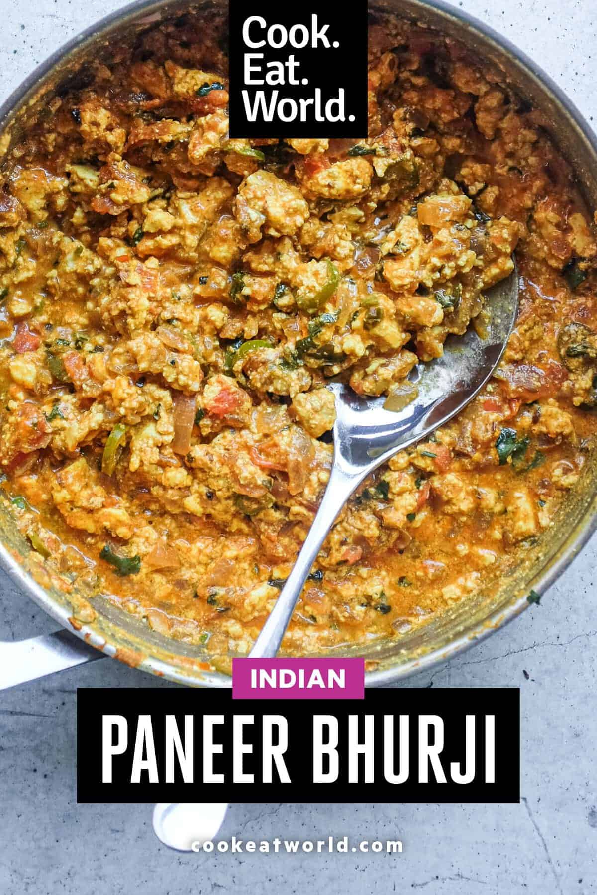 Rustic pan of Indian Paneer Bhurji topped with fresh cilantro and lime.