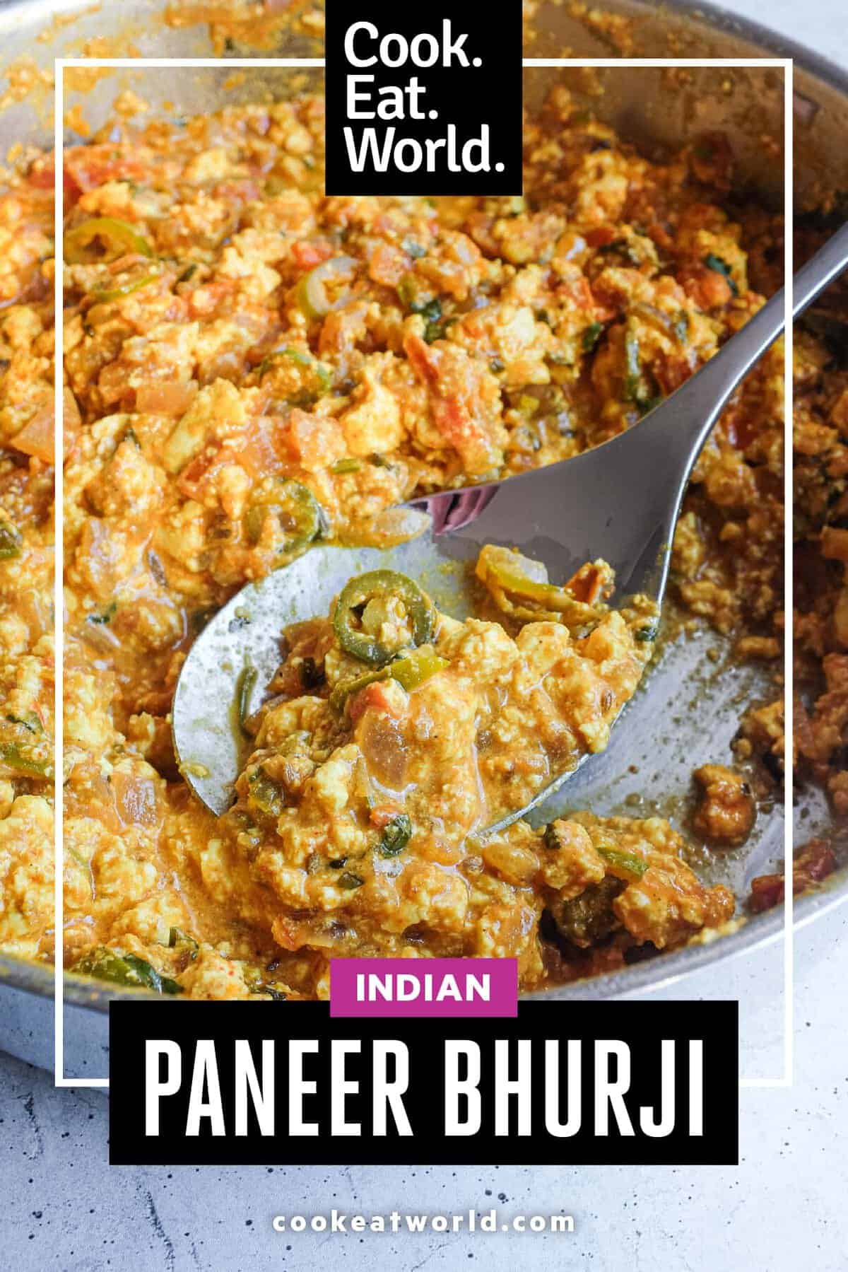 Rustic pan of Indian Paneer Bhurji topped with fresh cilantro and lime.