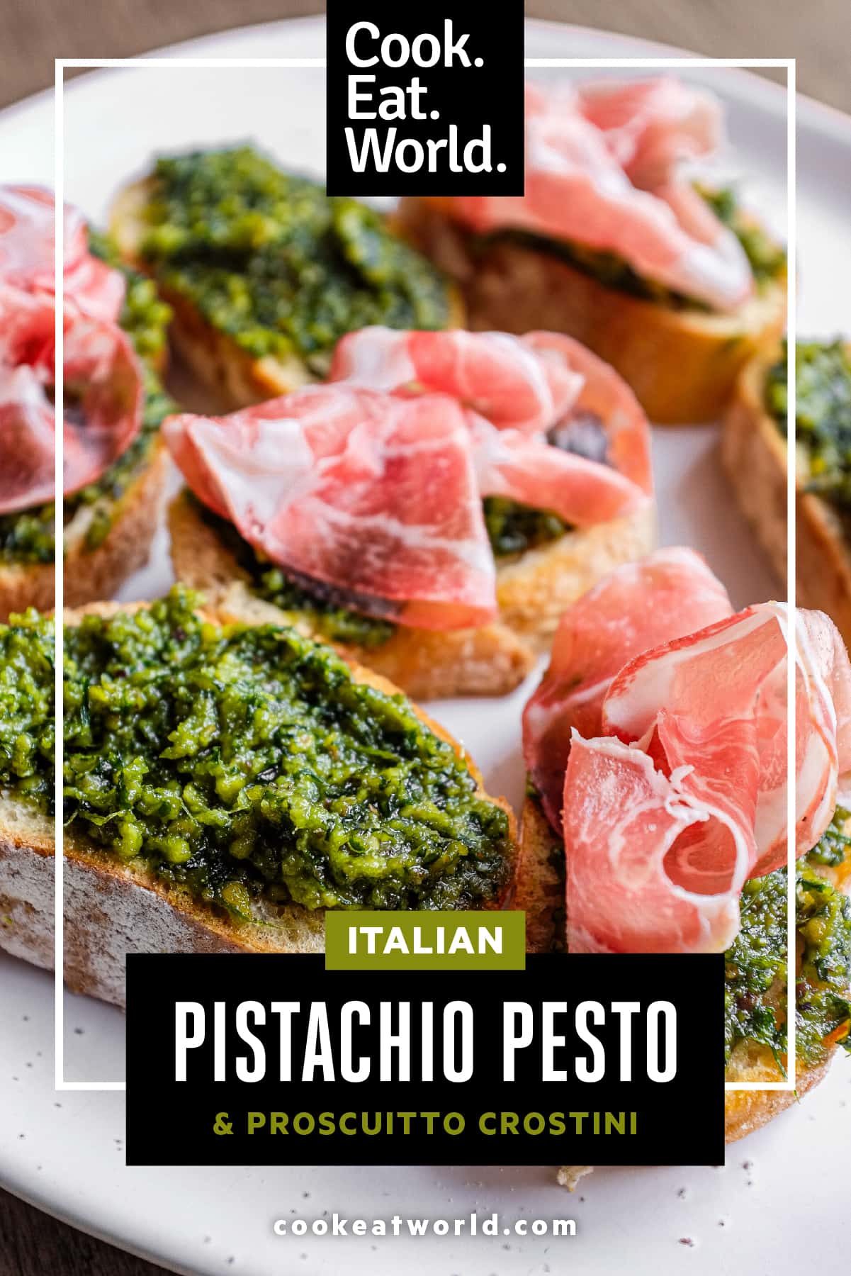 Fresh pistachio pesto crostini served as an Italian aperitivo with vegetarian and ham-topped options.