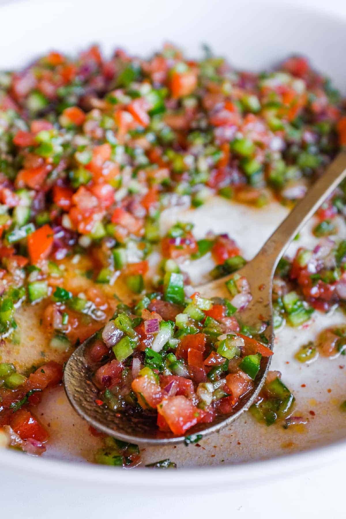 Fresh Turkish Kaşık Salatası made with finely chopped vegetables, parsley and a bright lemon and pomegranate molasses dressing.