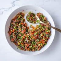 A refreshing bowl of Turkish Spoon Salad alongside grilled kebabs and Mediterranean side dishes.