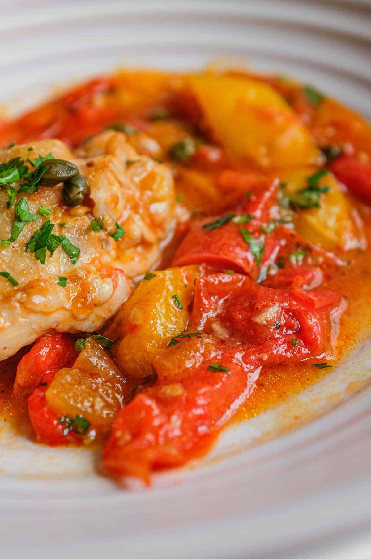 Roman chicken stew with tender chicken, sweet peppers, capers and chopped parsley.